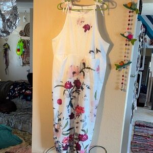 NWOT women's casual sleeveless jumpsuit romper featuring a floral print, wide le